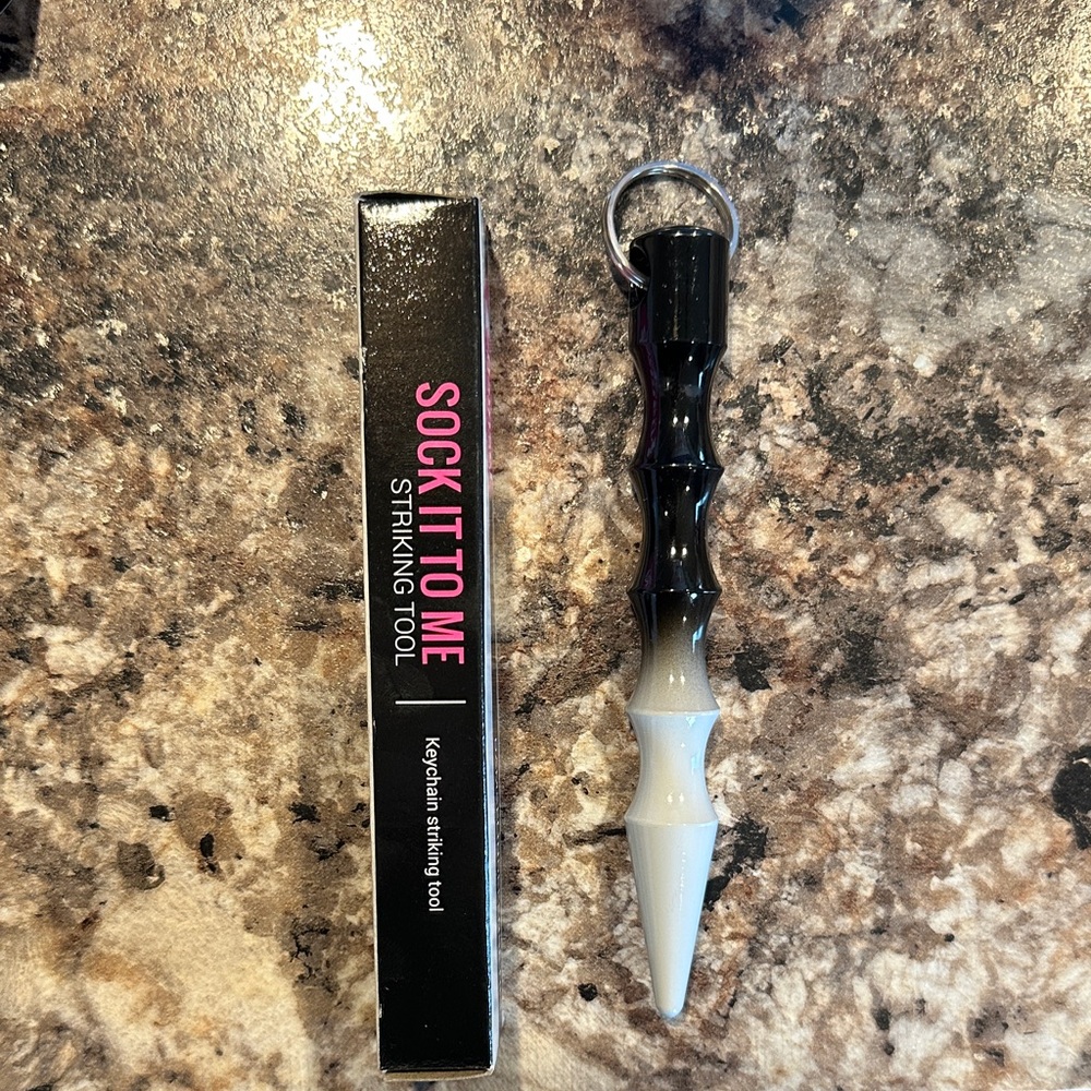 Damsel in Defense Black and White Sock It To Me striking Keychain